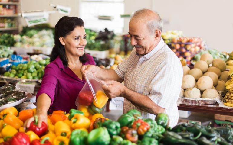 couple shopping for vegetables