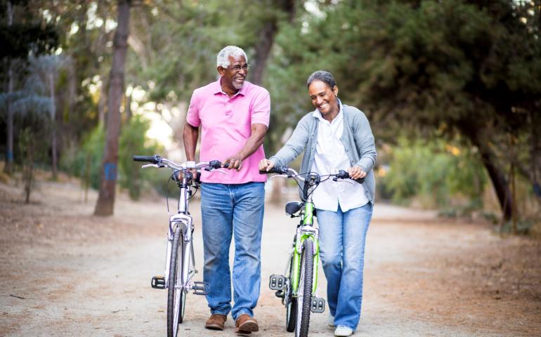 couple walking their bikes