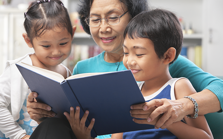 woman reading to kids 