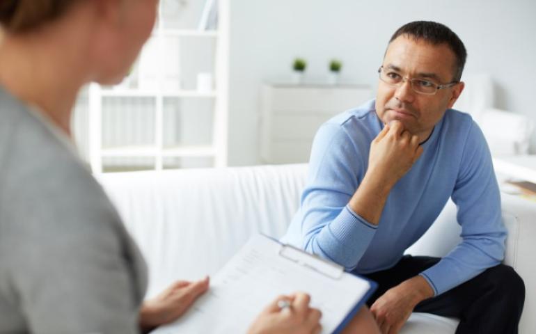 Man sitting on couch for counseling 