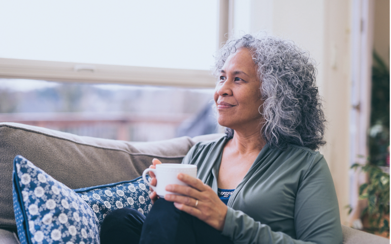 woman sitting holding a mug