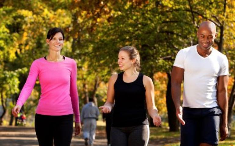 Three people walking outdoors