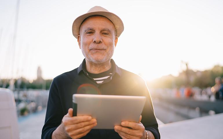 man with ipad