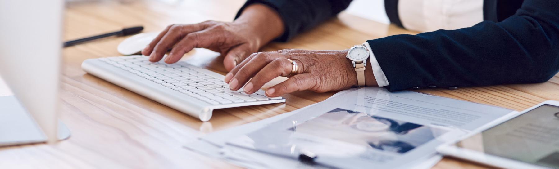 eBenefits Retiree Hero fingers typing on laptop