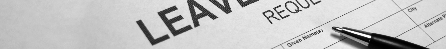 Image of a generic Leave of Absence Form and a pen on the form.